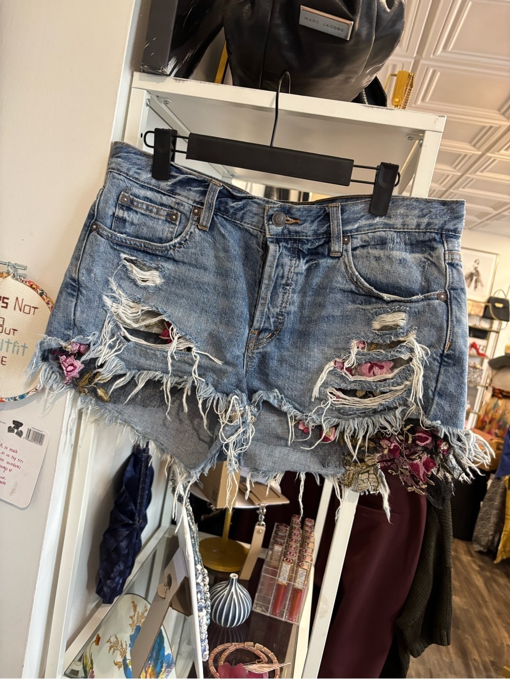 We The Free Blue Denim Cutoff Shorts with Frayed Hem and lace detail